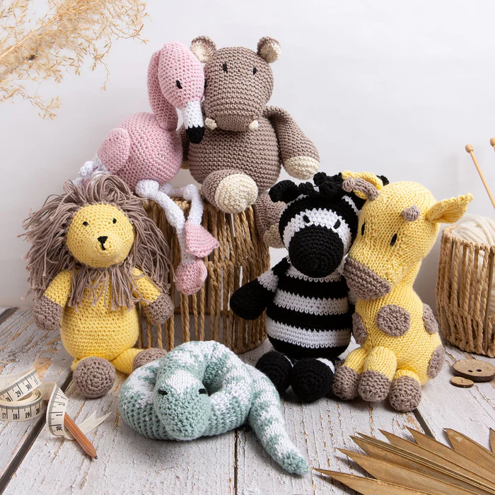 Cute handmade crochet stuffed animals arranged together, featuring safari and animal-themed crochet toys| Crochet
